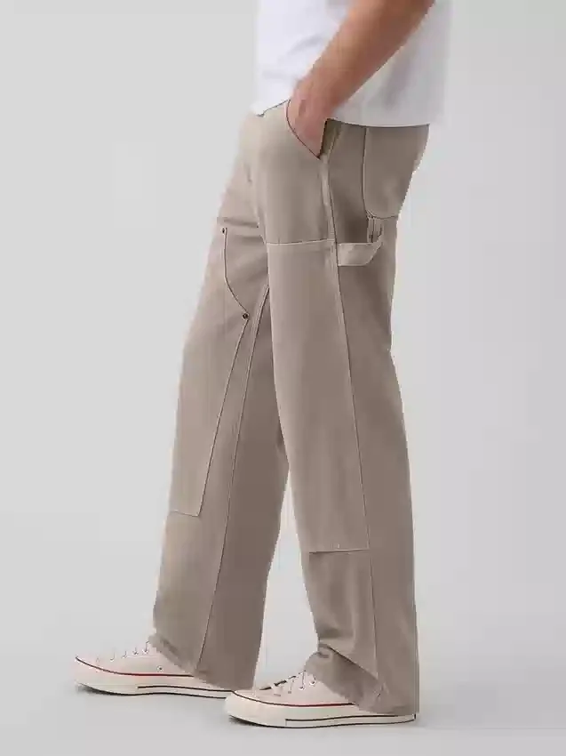 90-talsinspirerade, lösa snickarjeans med dubbla knän