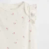Baby First Favorites bodysuit i ekologisk bomull med fladdrande ärmar