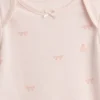 Baby First Favorites bodysuit i ekologisk bomull med rosett
