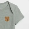 Baby First Favorites bodysuit i våffelstickning
