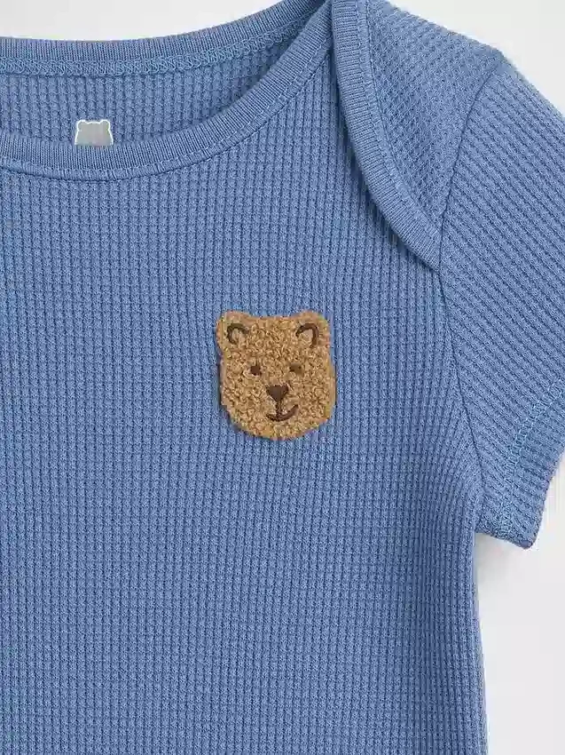 Baby First Favorites bodysuit i våffelstickning