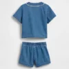 Baby-klädset i denim i varsity-stil