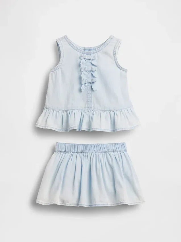 Baby-klädset i denim med rosett