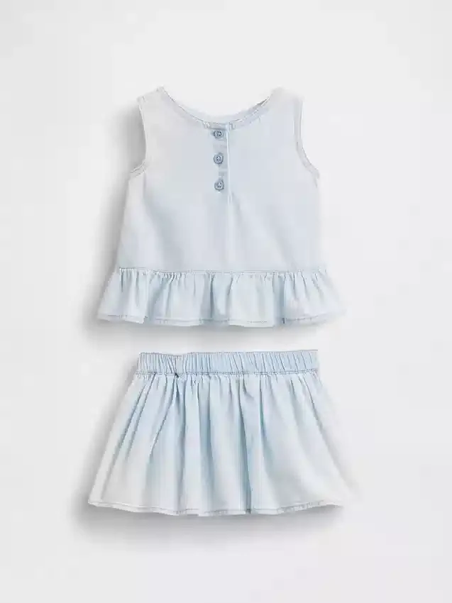 Baby-klädset i denim med rosett