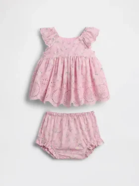 Baby-klädset med hålbroderier