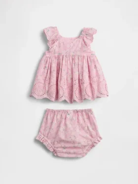 Baby-klädset med hålbroderier