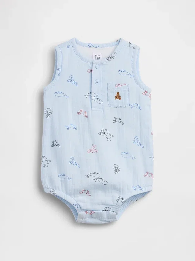 Babybodysuit i bomullsgasväv med Henley-krage och ficka