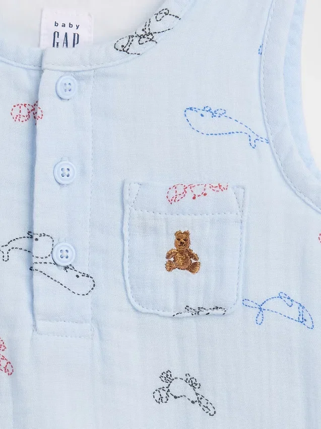 Babybodysuit i bomullsgasväv med Henley-krage och ficka