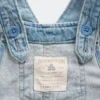 Babyoverall i denim med broderade blommor