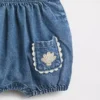 Babyoverall i denim med fickor