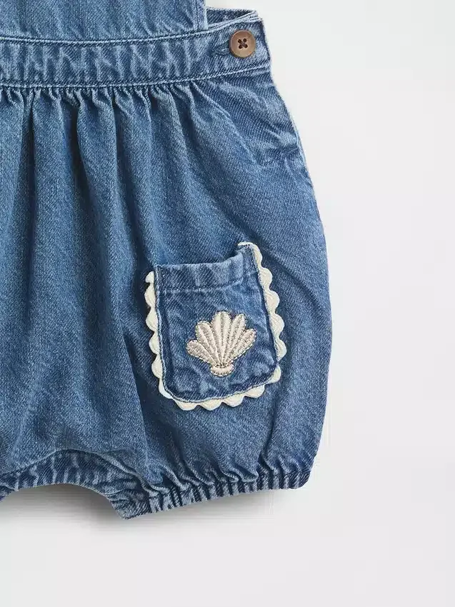 Babyoverall i denim med fickor