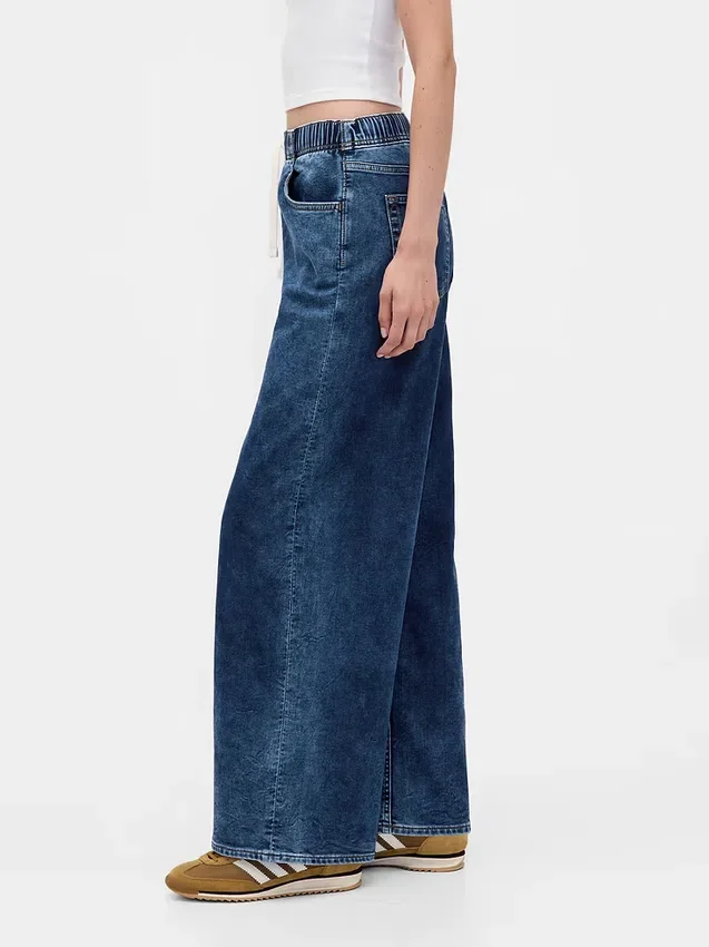 Baggy-jeans i stickad denim med medelhög midja