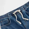 Baggy-jeans i stickad denim med medelhög midja