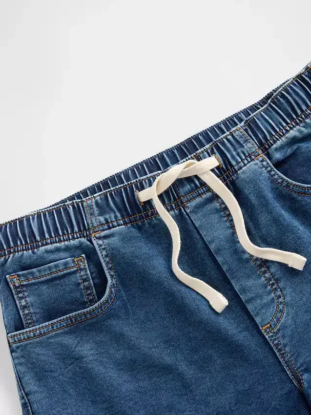 Baggy-jeans i stickad denim med medelhög midja