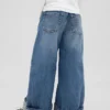 Barnjeans med låg midja, vid ben och avslappnad passform