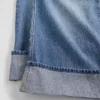 Barnjeans med låg midja, vid ben och avslappnad passform