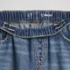 Barnjeans med låg midja, vid ben och avslappnad passform