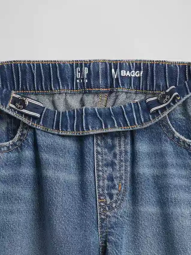 Barnjeans med låg midja, vid ben och avslappnad passform