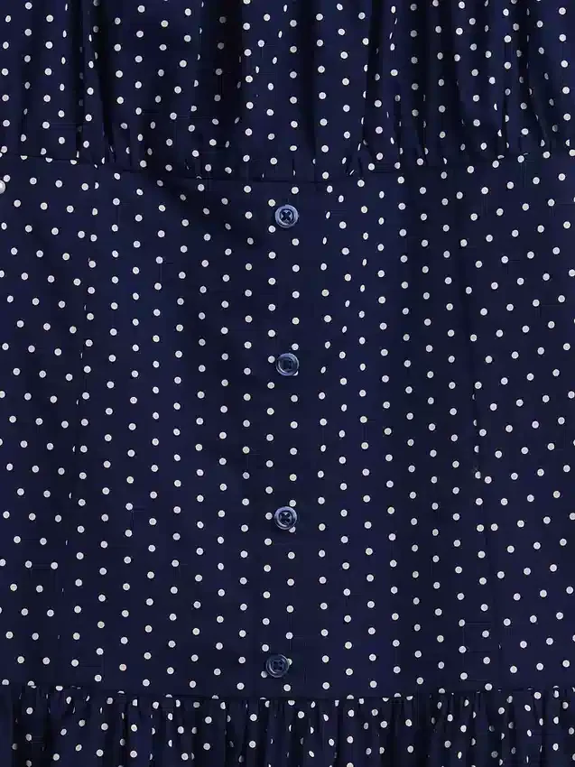 Barnklänning med polka-mönster och låg midja