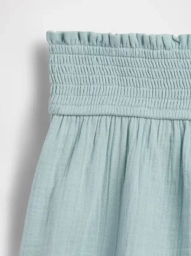 Barnshorts i bomullsgasväv med fjärilskant