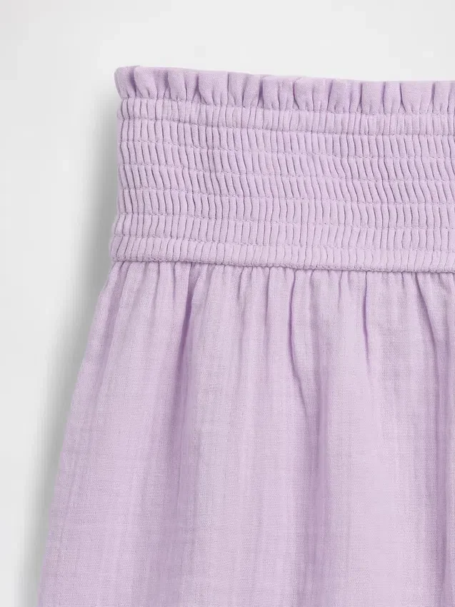 Barnshorts i bomullsgasväv med fjärilskant
