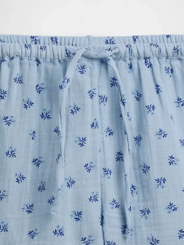 Barnshorts i bomullsgasväv med volanger