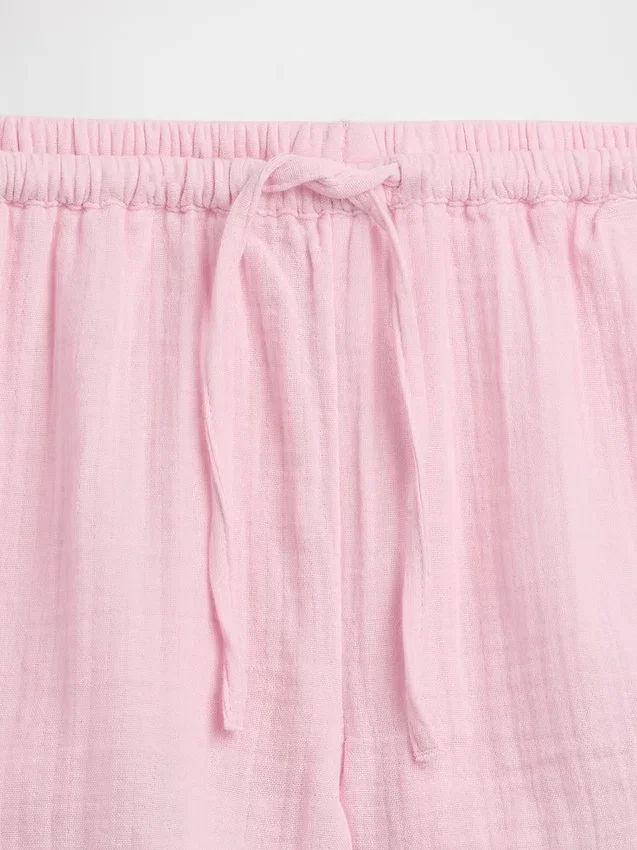 Barnshorts i bomullsgasväv med volanger