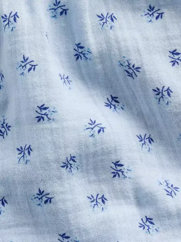 Barnshorts i bomullsgasväv med volanger