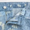 Barnshorts i denim med låg midja och blommönster