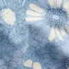 Barnshorts i denim med låg midja och blommönster
