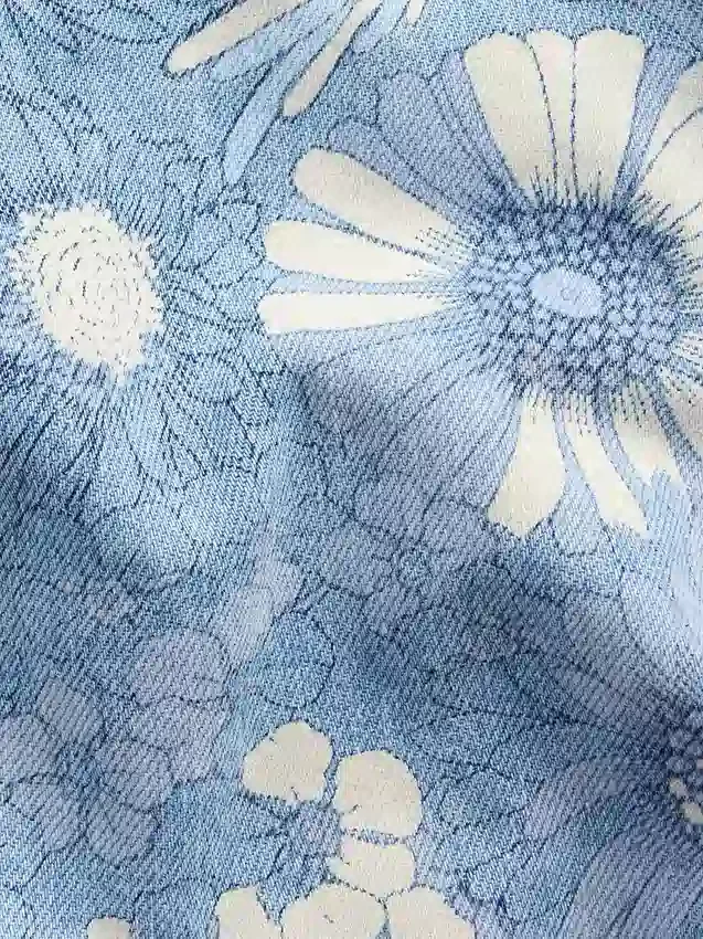 Barnshorts i denim med låg midja och blommönster