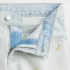 Barnshorts i låg midja med broderat citronmönster i denim