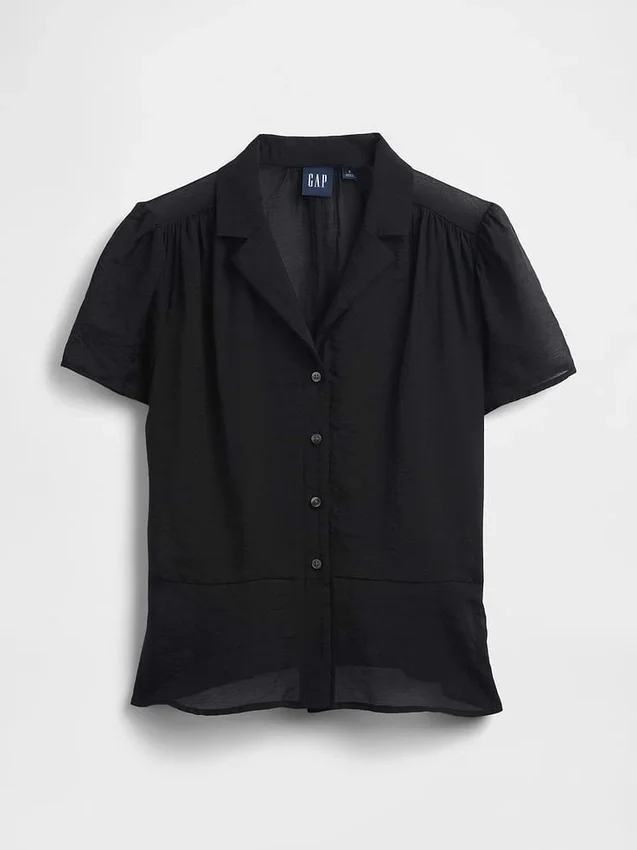 Genomskinlig peplum-top med knappar framtill