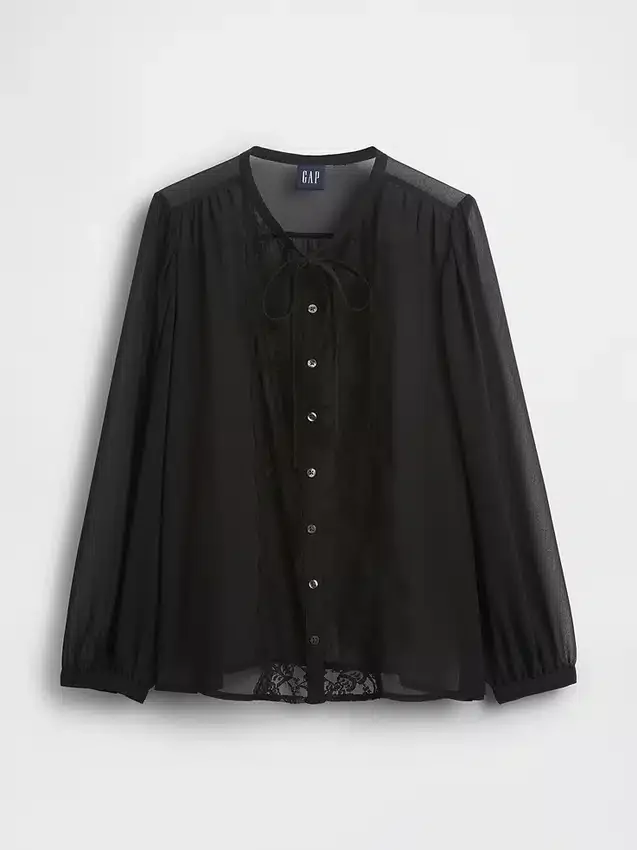 Genomskinlig topp med insatser av återvunnet spets och knytning vid halsen