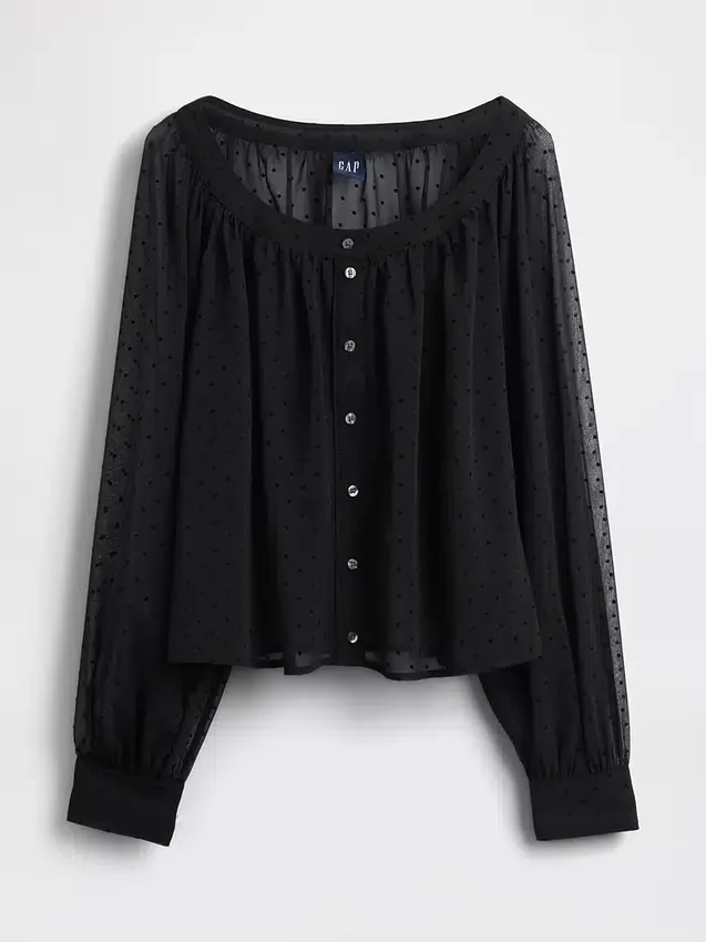 Genomskinlig topp med knappar framtill