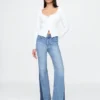 Högmidjade 70-talsinspirerade flare-Jeans med lappar