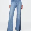 Högmidjade 70-talsinspirerade flare-Jeans med lappar