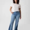 Högmidjade 70-talsinspirerade flare-Jeans med lappar