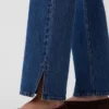 Jeans med medelhög midja, delad fåll och avslappnad rak passform