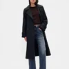 Jeans med medelhög midja, styv passform och avslappnad utsvängd benform