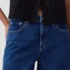 Jeansshorts med medelhög midja och lång passform