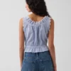 Kort peplum-top med hålkant och knytning fram
