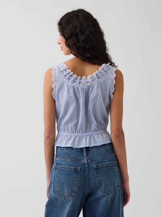 Kort peplum-top med hålkant och knytning fram
