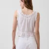 Kort peplum-top med hålkant och knytning fram
