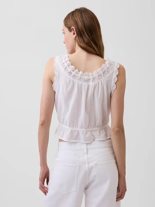Kort peplum-top med hålkant och knytning fram