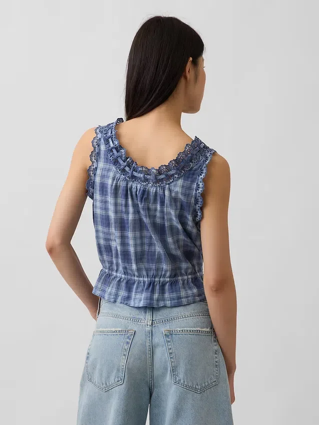 Kort peplum-top med hålkant och knytning fram