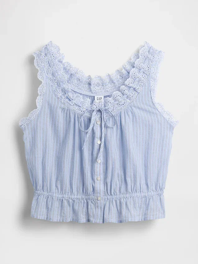 Kort peplum-top med hålkant och knytning fram