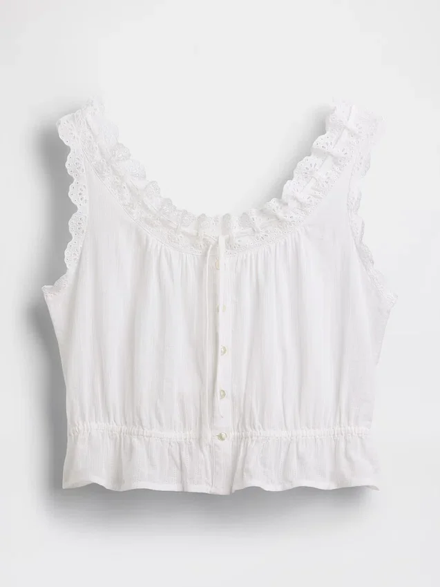 Kort peplum-top med hålkant och knytning fram