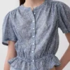 Kort peplum-top med knappar fram
