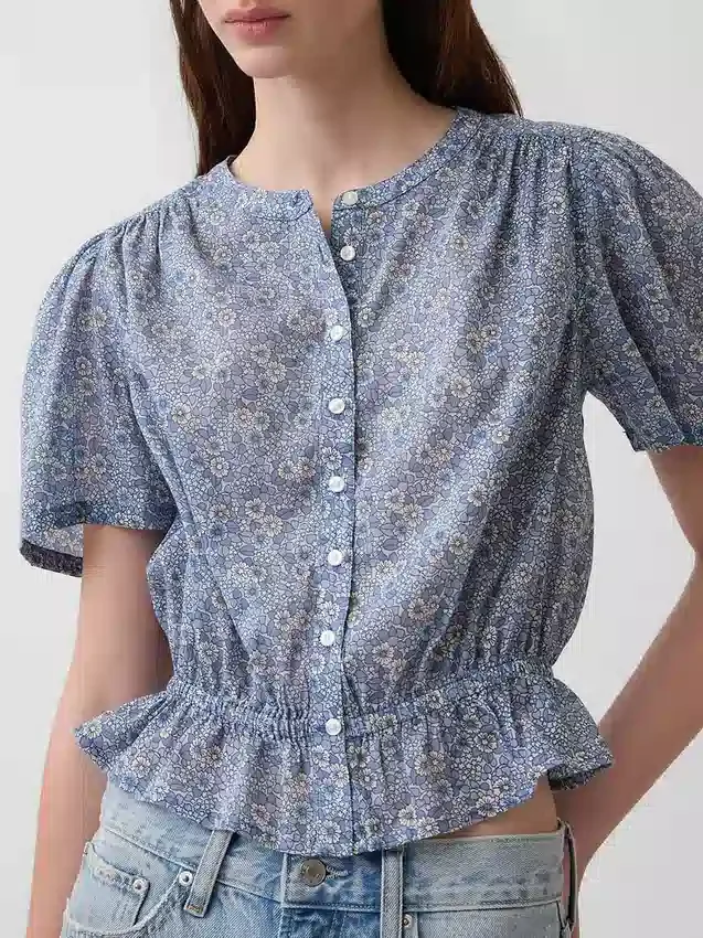 Kort peplum-top med knappar fram